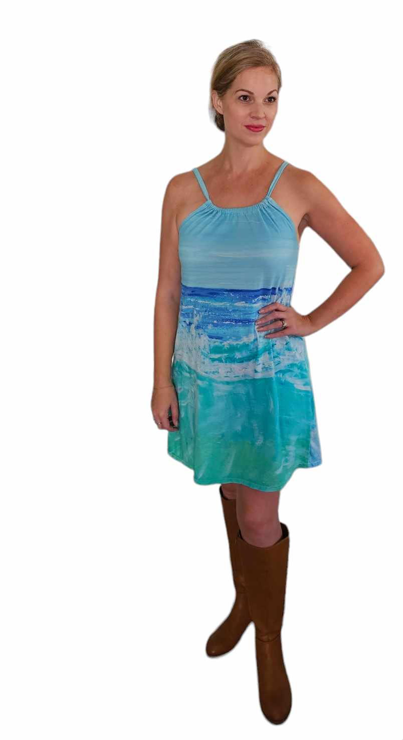 Woman wearing a blue wave cotton beach or vacation dress.