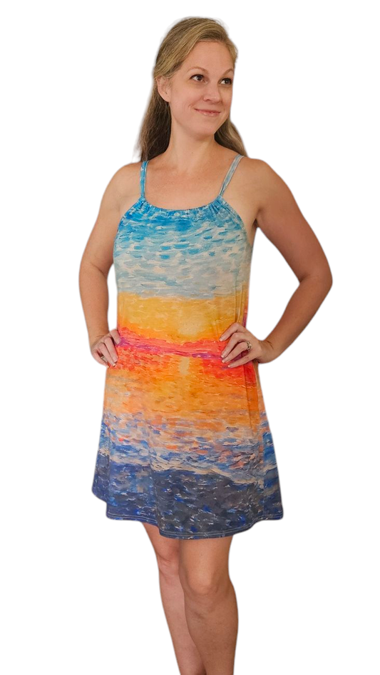 Woman in knee length summer  Beach vacation dress with abstract sunrise design it is 100% cotton